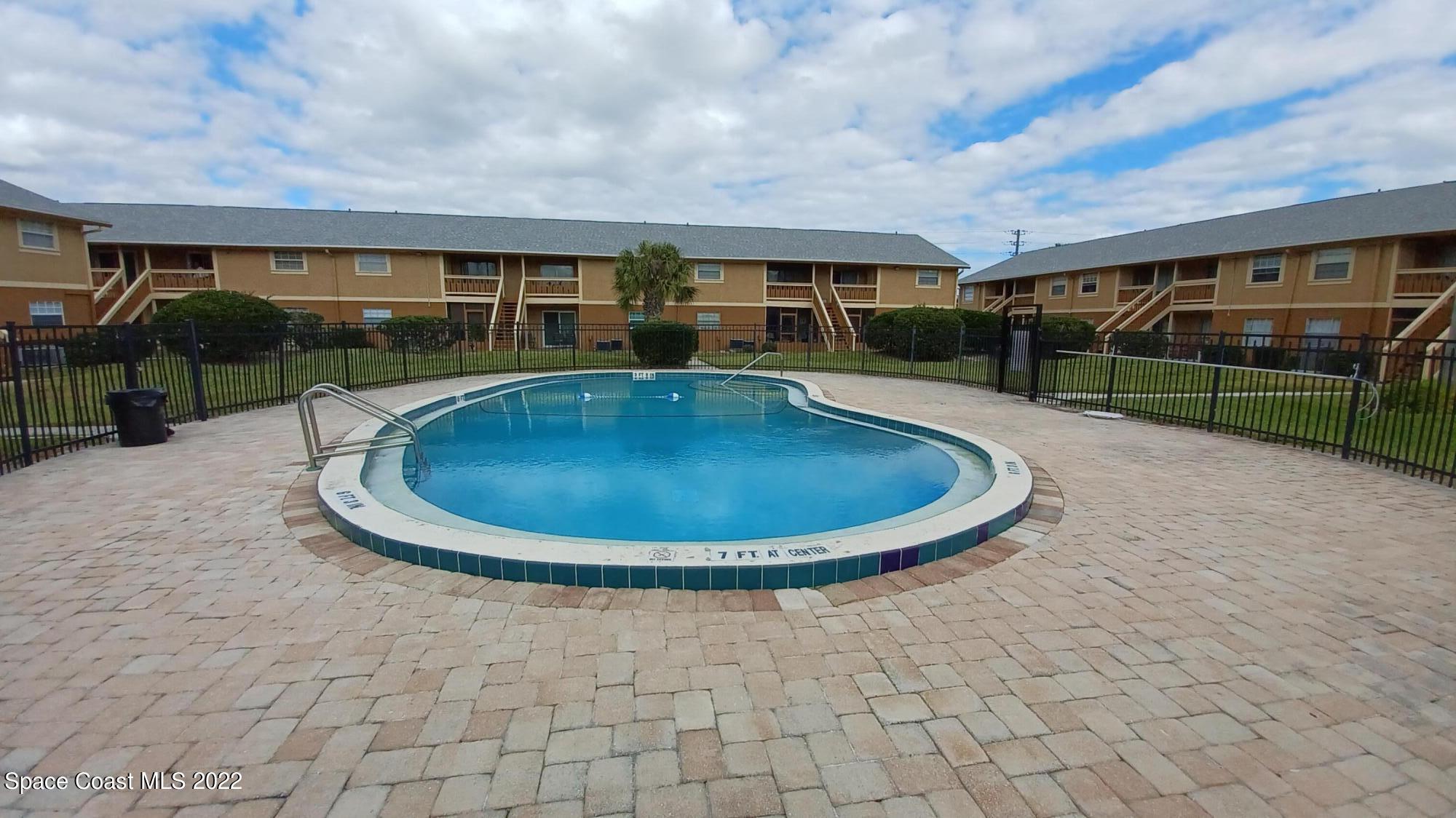 181 Ulster Lane Melbourne, FL 32935 - Photo 17 of 29 a view of swimming pool having outdoor seating