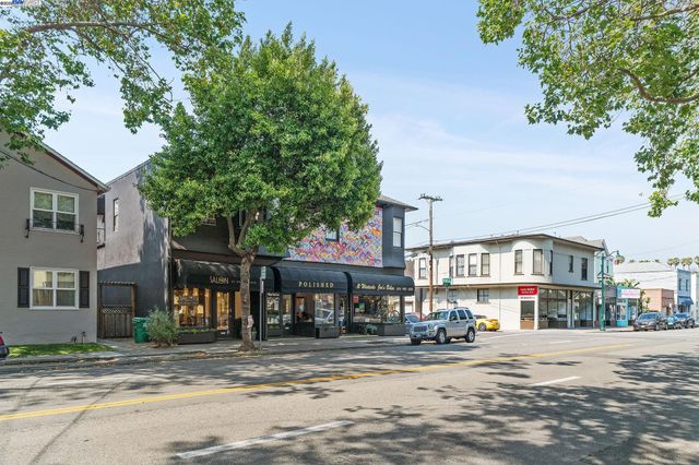 a city street lined with buildings and trees