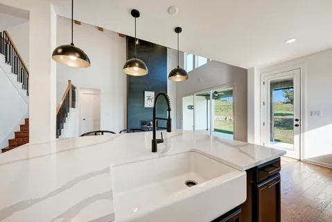 a kitchen with stainless steel appliances white cabinets and a stove