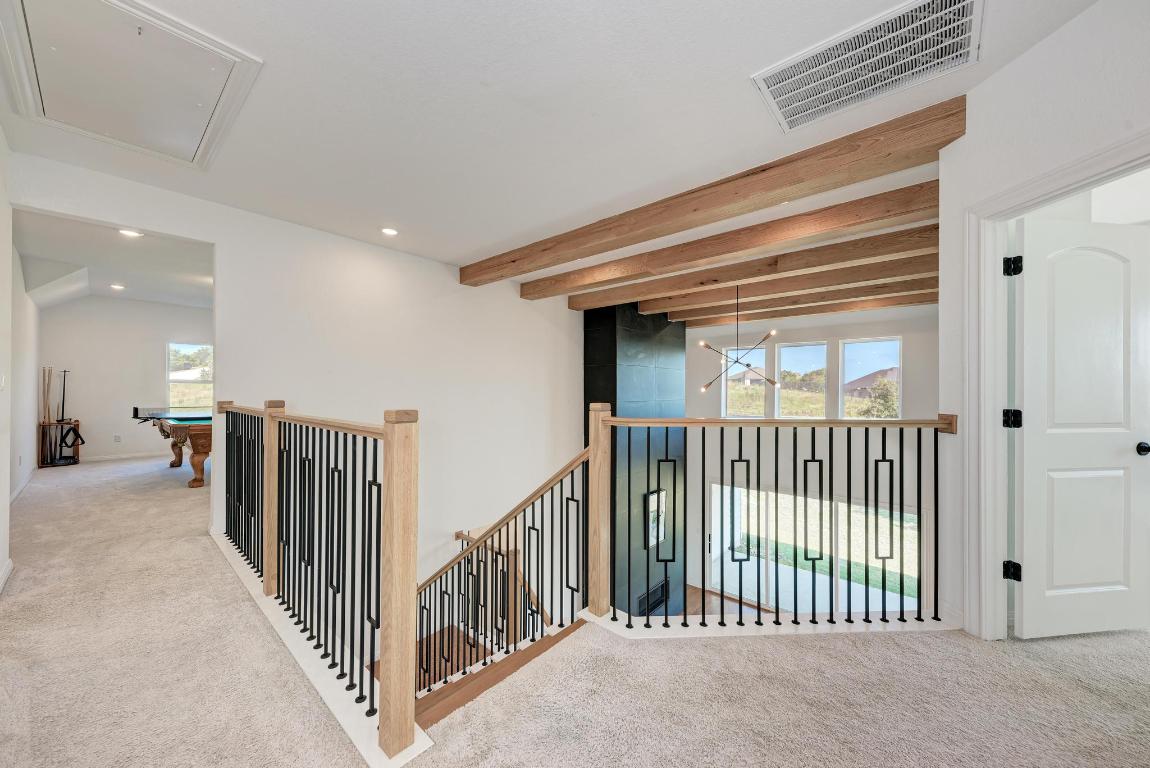 156 Verdejo Drive Dripping Springs, TX 78620 - Photo 24 of 40 a view of a hallway with a porch