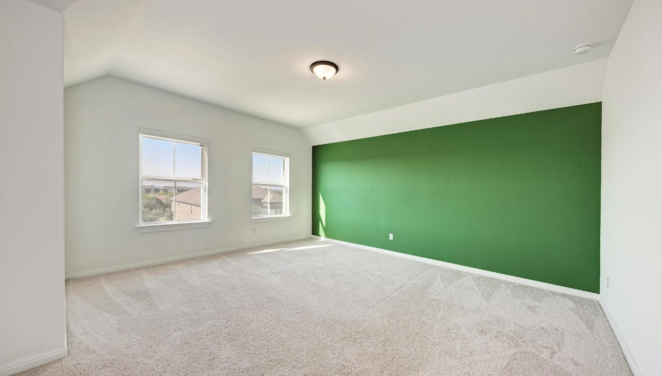 156 Verdejo Drive Dripping Springs, TX 78620 - Photo 27 of 40 a view of a big room with windows and yard