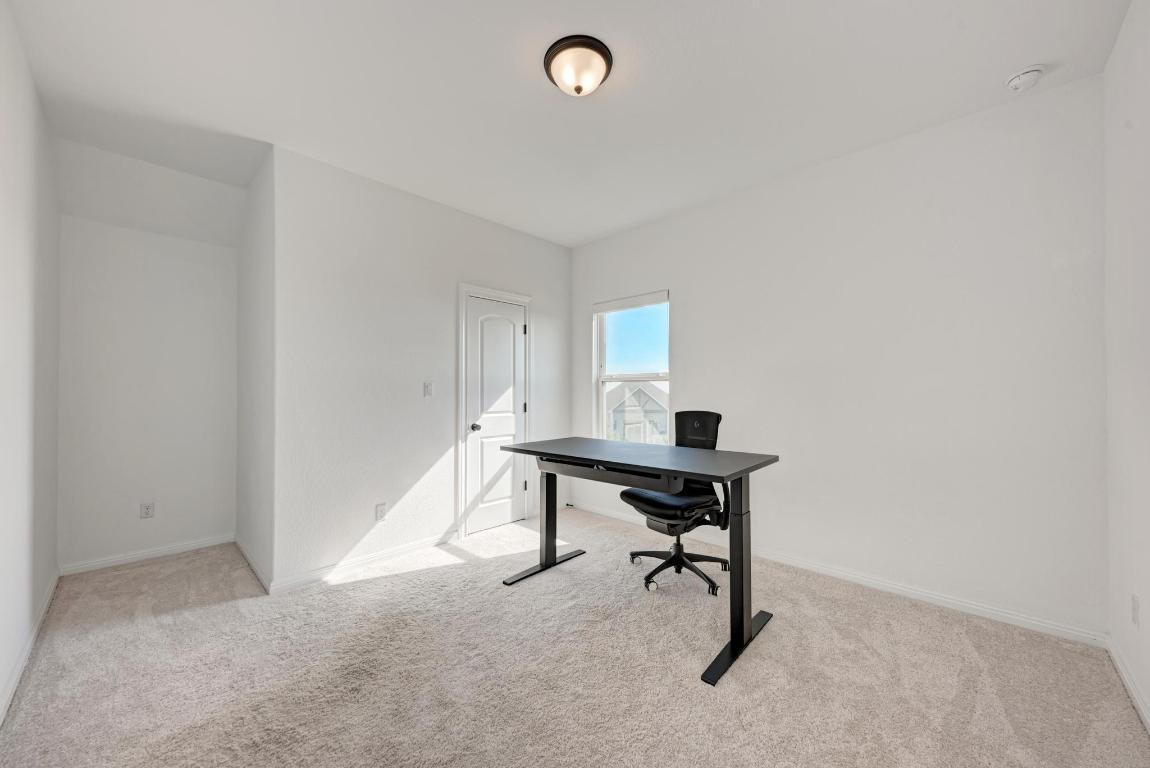 156 Verdejo Drive Dripping Springs, TX 78620 - Photo 31 of 40 a view of a workspace with furniture