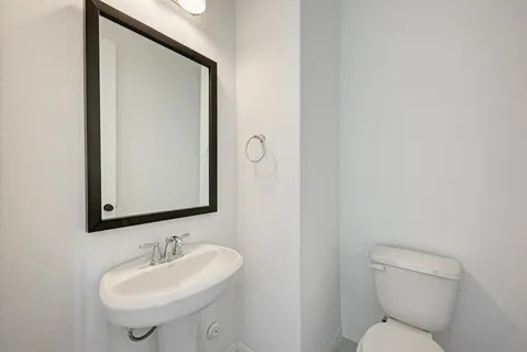 a en suite bathroom with a double vanity sink shower and a mirror