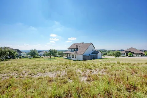 a house with trees in the background