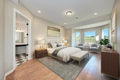 a bed room with bed and a large window