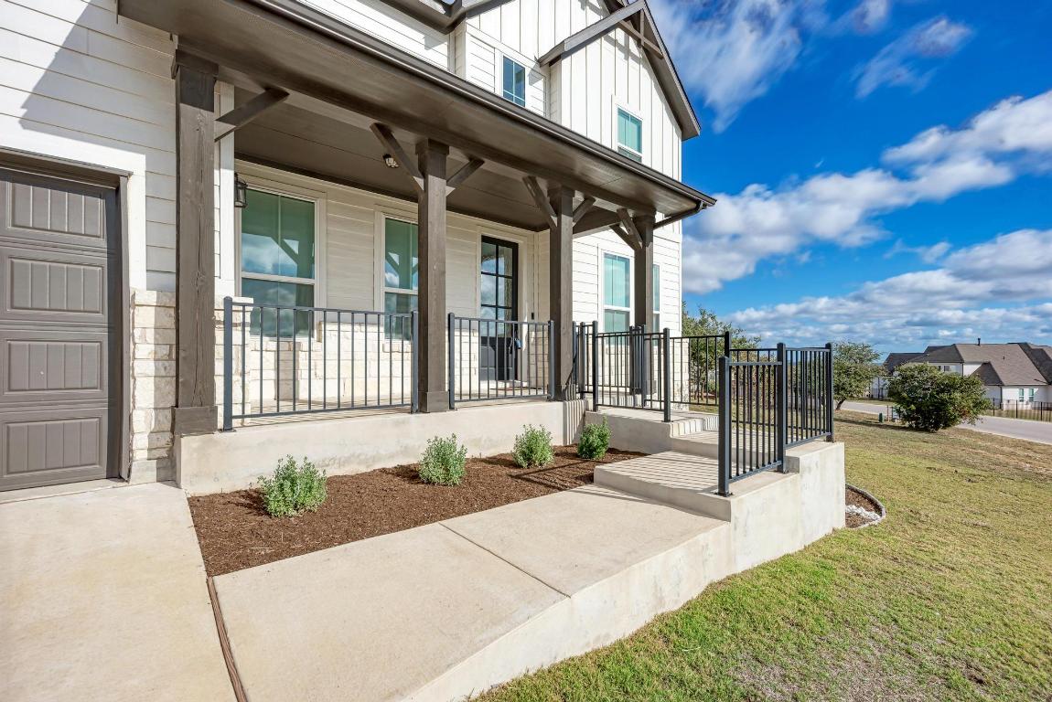156 Verdejo Drive Dripping Springs, TX 78620 - Photo 6 of 40 a front view of a house with a yard