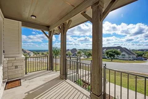 a view of a porch with a floor to ceiling window