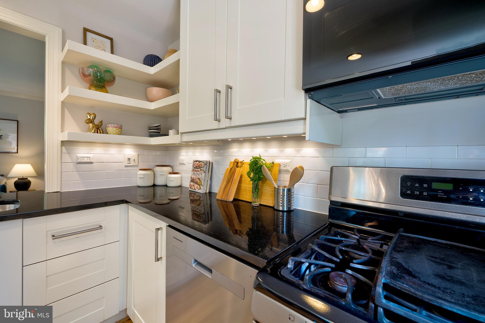 1730 Dublin Drive Silver Spring, MD 20902 - Photo 13 of 50 a kitchen with appliances cabinets and a sink
