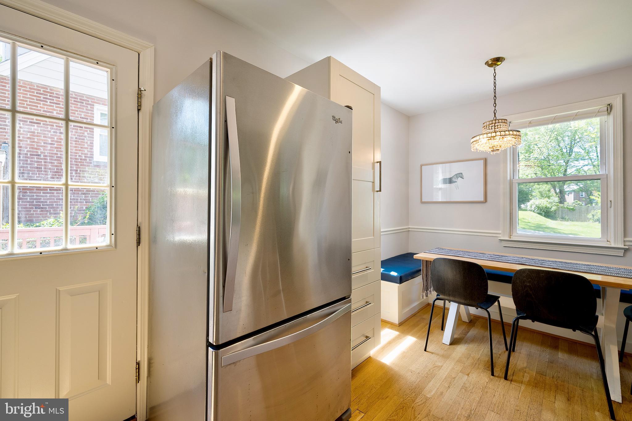 1730 Dublin Drive Silver Spring, MD 20902 - Photo 14 of 50 a dining room with a window and stainless steel appliances