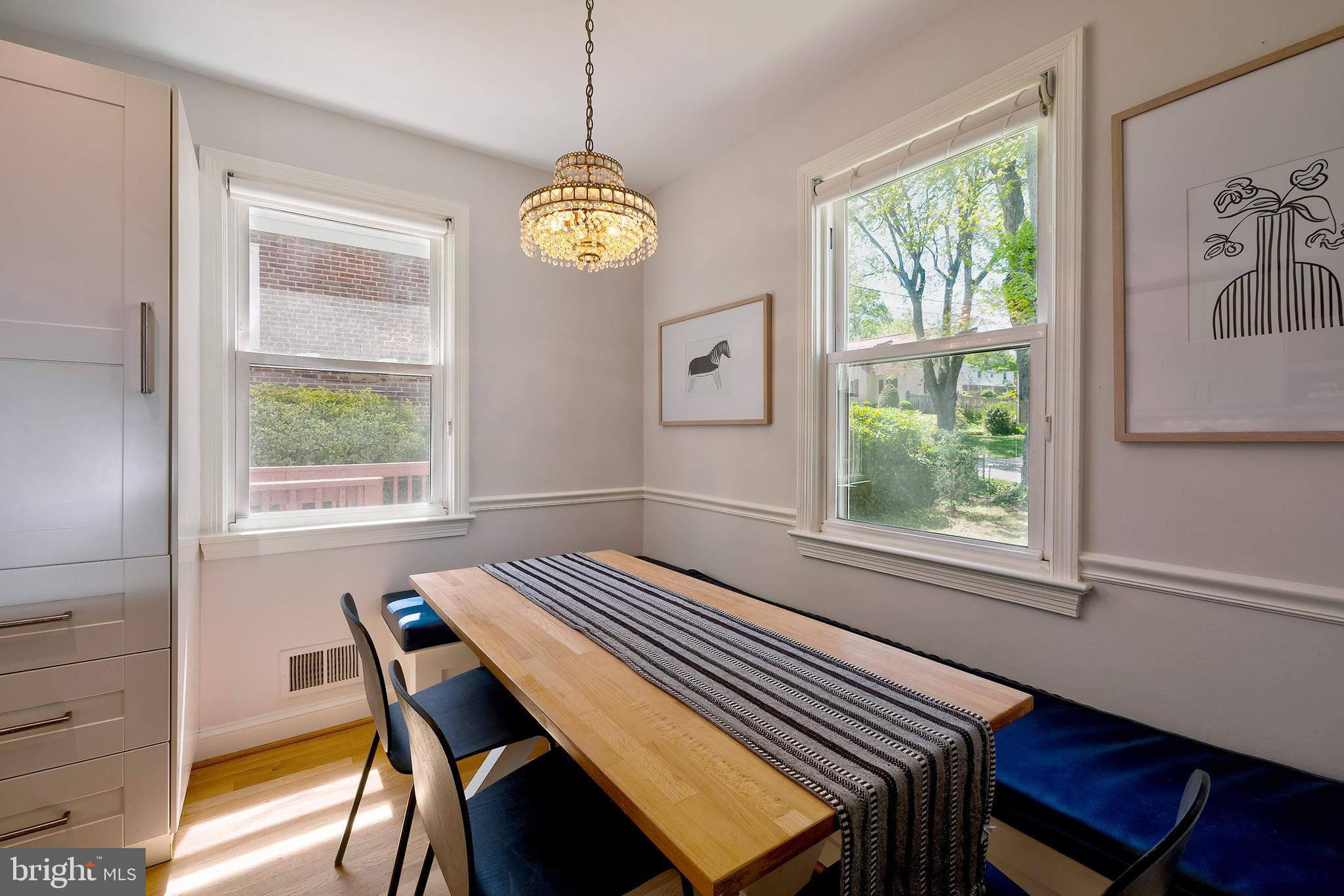 1730 Dublin Drive Silver Spring, MD 20902 - Photo 16 of 50 a view of a dining room with furniture a chandelier and wooden floor
