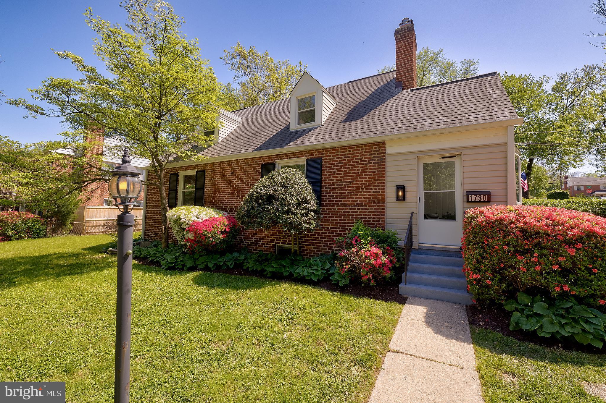 1730 Dublin Drive Silver Spring, MD 20902 - Photo 2 of 50 a front view of a house with garden