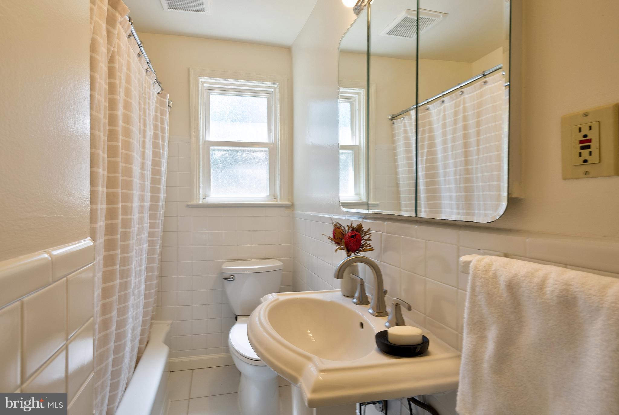 1730 Dublin Drive Silver Spring, MD 20902 - Photo 21 of 50 a bathroom with a sink and a mirror