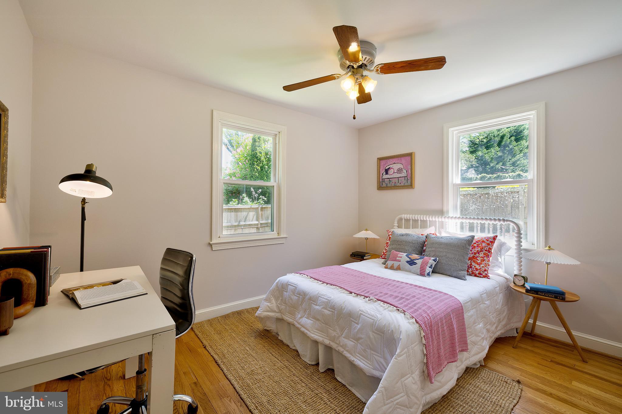 1730 Dublin Drive Silver Spring, MD 20902 - Photo 23 of 50 a bedroom with a bed and a chandelier
