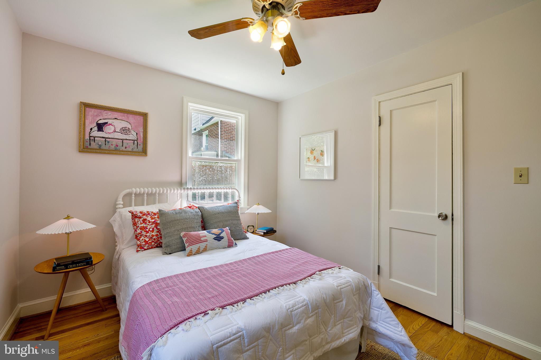 1730 Dublin Drive Silver Spring, MD 20902 - Photo 24 of 50 a bedroom with a bed and wooden floor