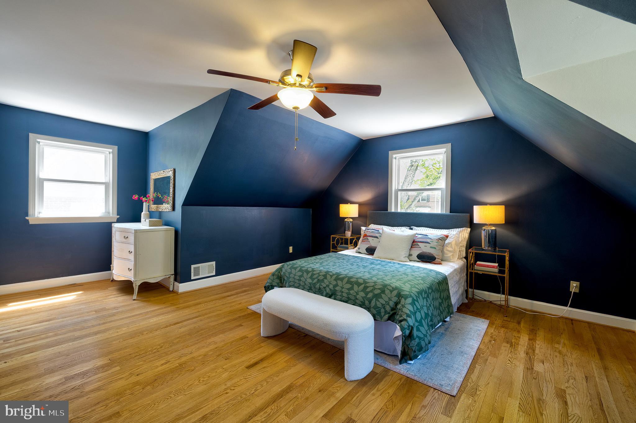 1730 Dublin Drive Silver Spring, MD 20902 - Photo 26 of 50 a bedroom with a bed and wooden floor