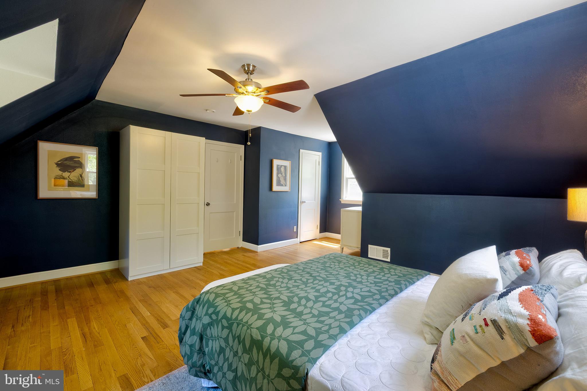 1730 Dublin Drive Silver Spring, MD 20902 - Photo 27 of 50 a bedroom with a bed and a chandelier