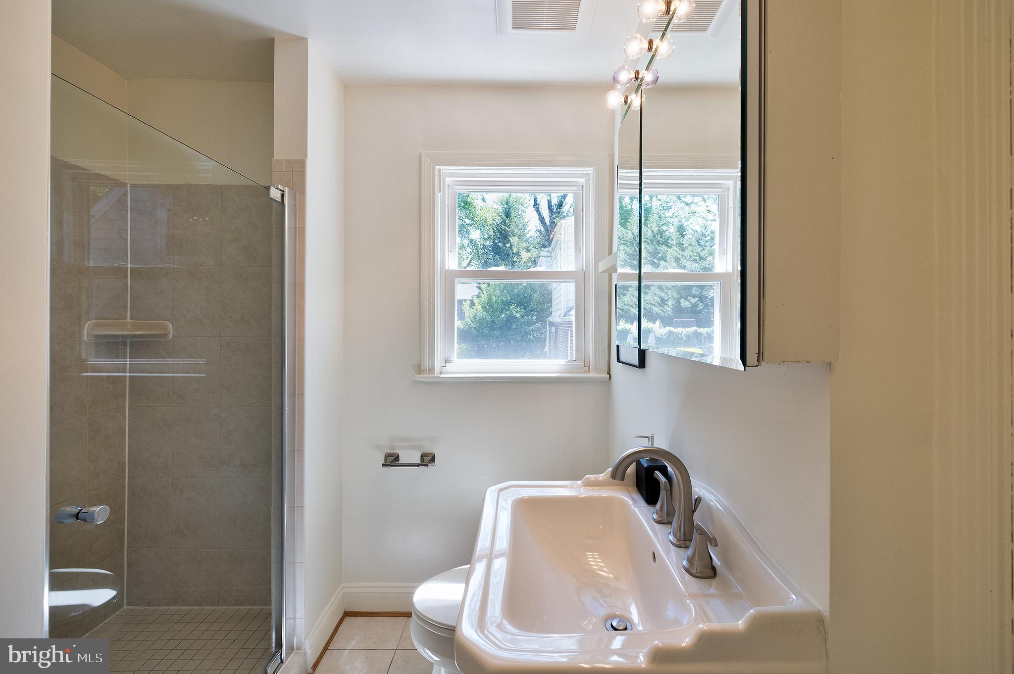 1730 Dublin Drive Silver Spring, MD 20902 - Photo 30 of 50 a bathroom with a sink and a window
