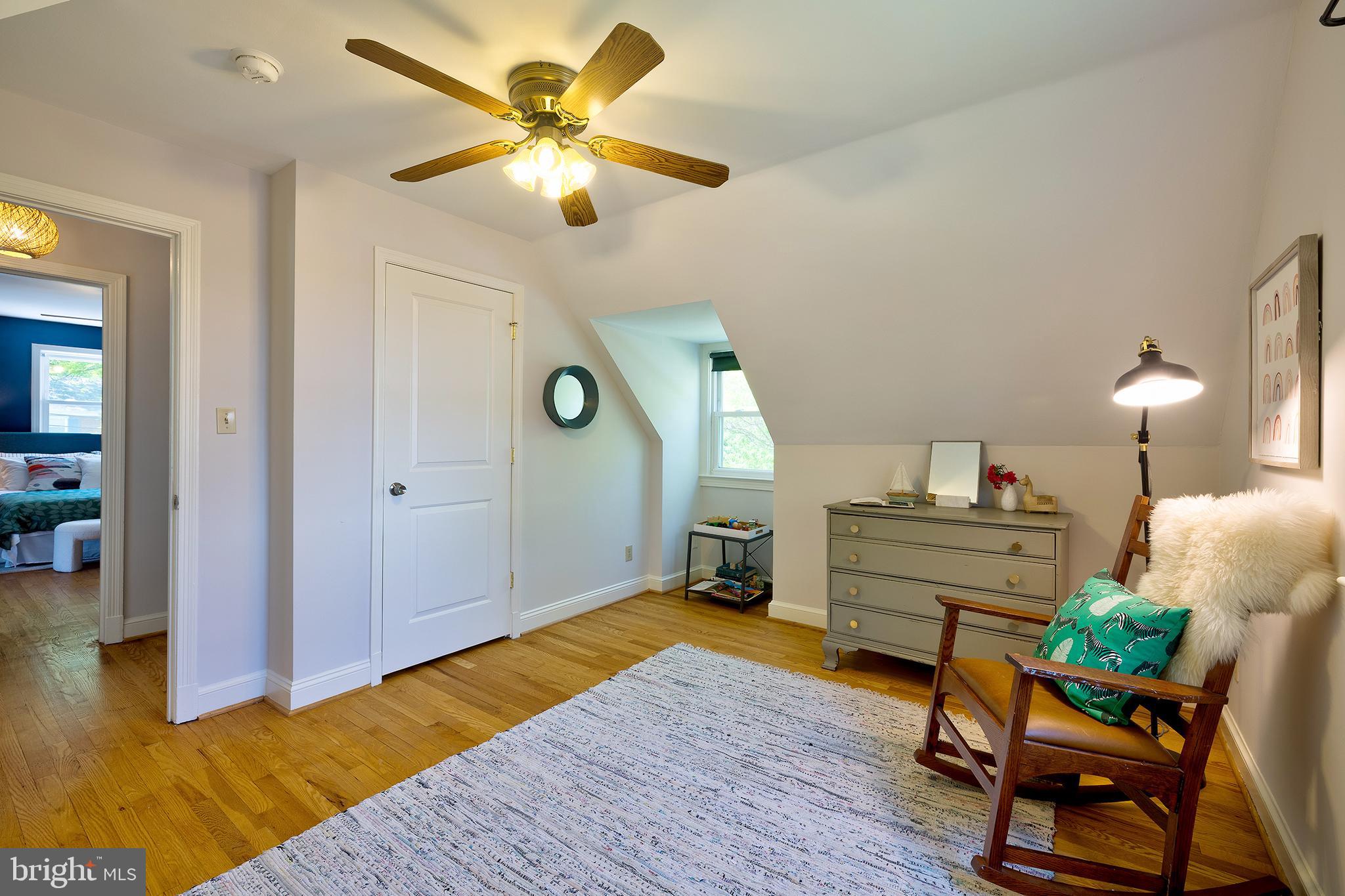 1730 Dublin Drive Silver Spring, MD 20902 - Photo 35 of 50 a bedroom with a bed and a chandelier