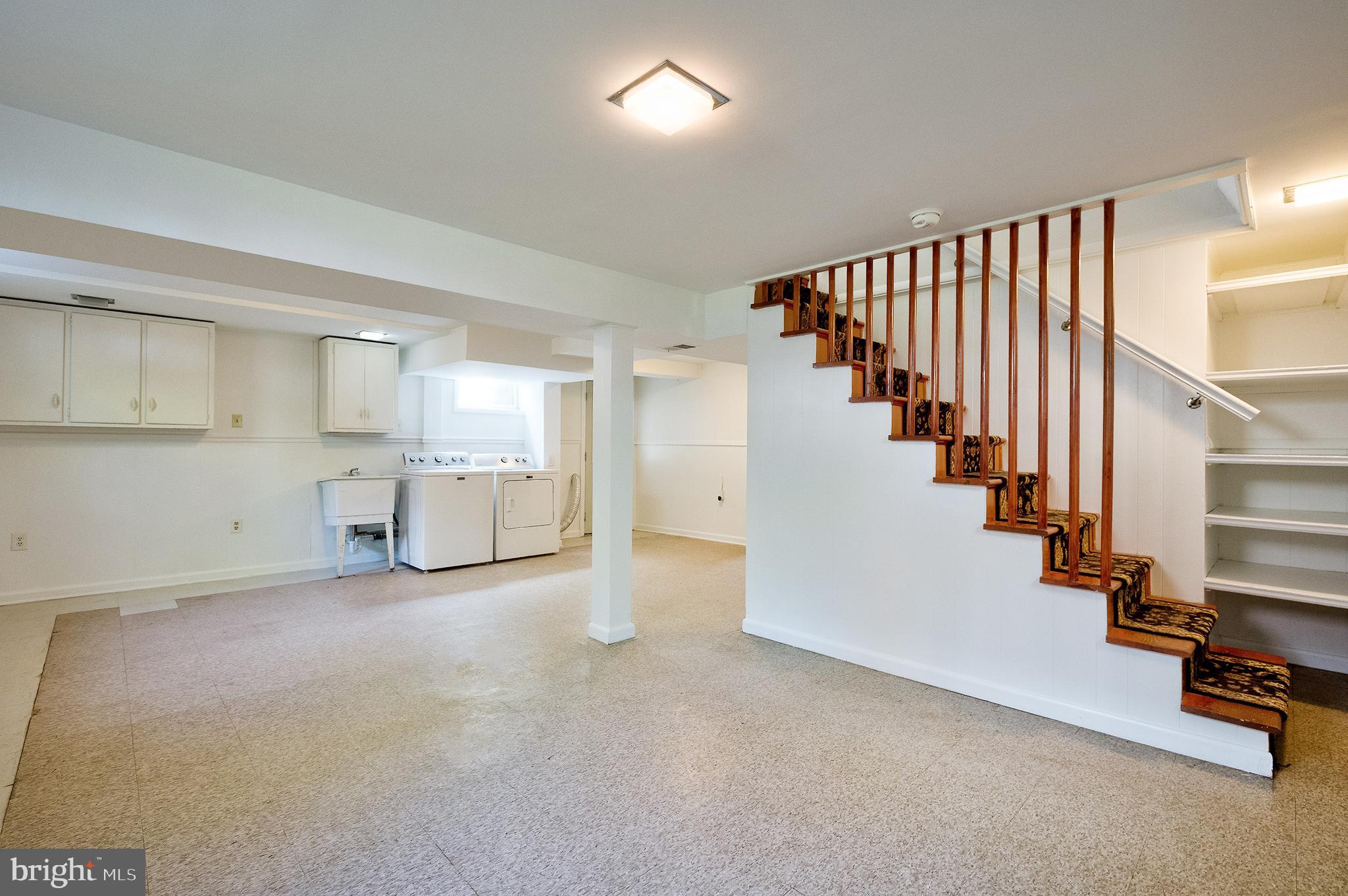 1730 Dublin Drive Silver Spring, MD 20902 - Photo 36 of 50 an empty room with wooden floor and windows