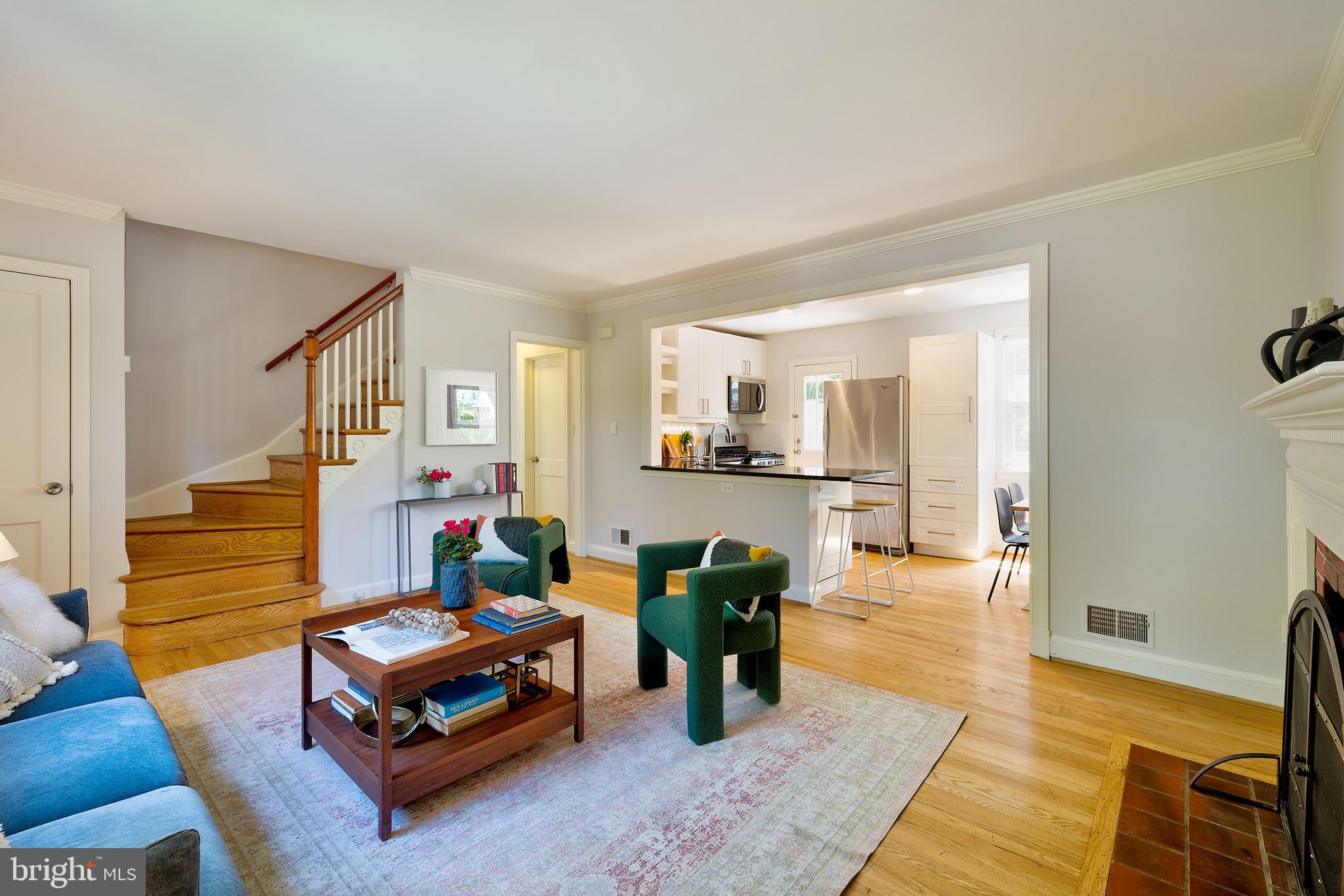 1730 Dublin Drive Silver Spring, MD 20902 - Photo 6 of 50 a living room with furniture and a dining table with wooden floor