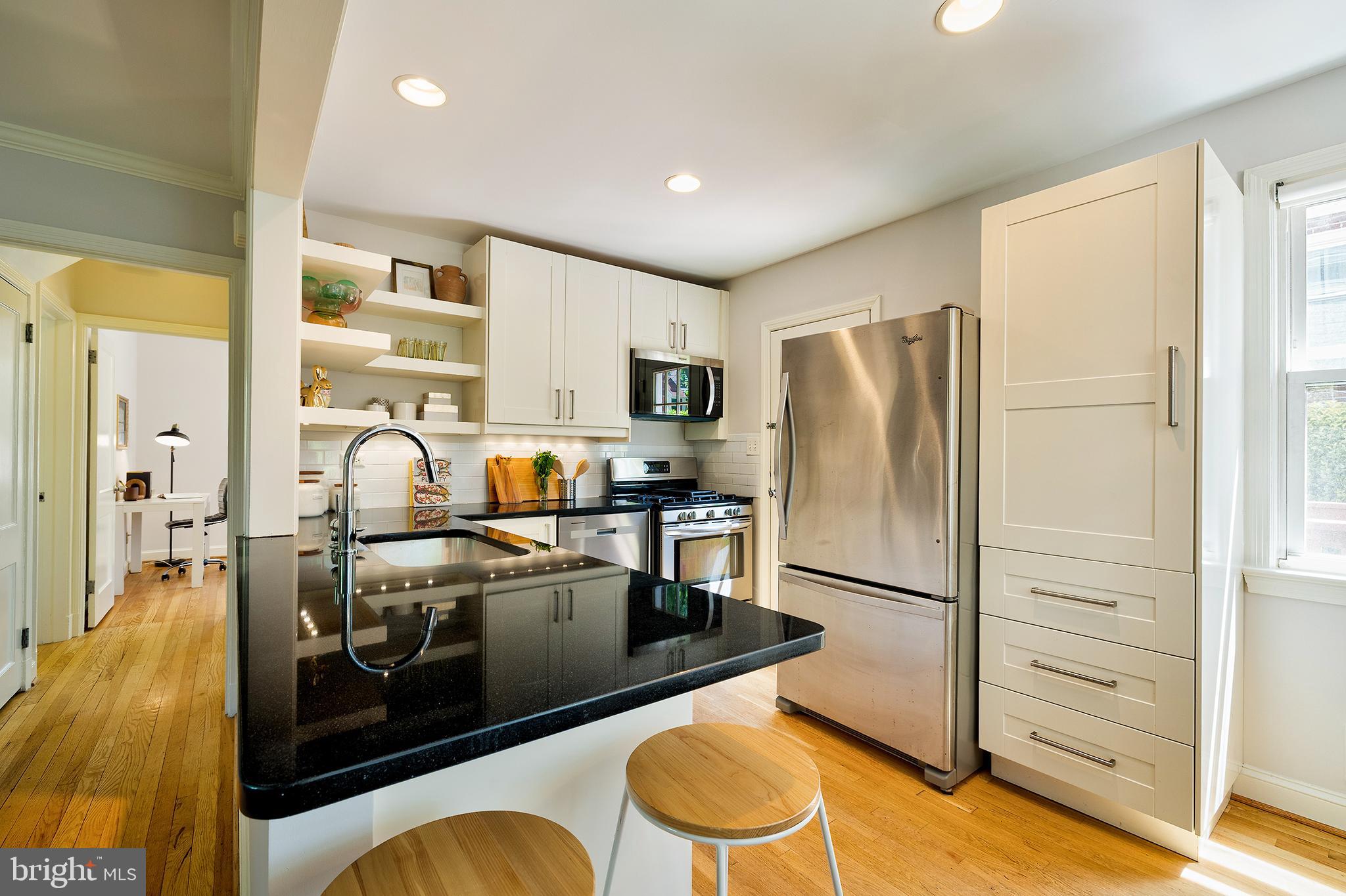 1730 Dublin Drive Silver Spring, MD 20902 - Photo 10 of 50 a kitchen with stainless steel appliances granite countertop a refrigerator and a stove
