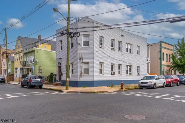 a view of a house with backyard sitting area and garden