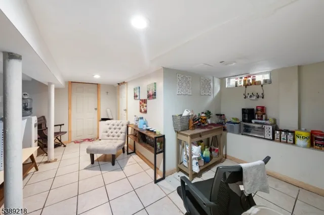 a living room with furniture and a piano