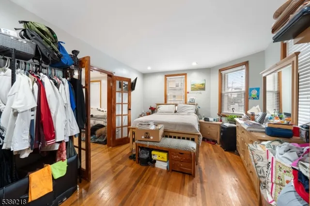 a bed room with a bed and a gym machine