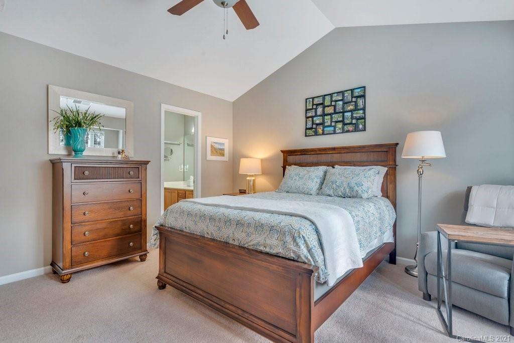 11620 Rabbit Ridge Road Charlotte, NC 28270 - Photo 11 of 24 a bedroom with a bed and a cabinets