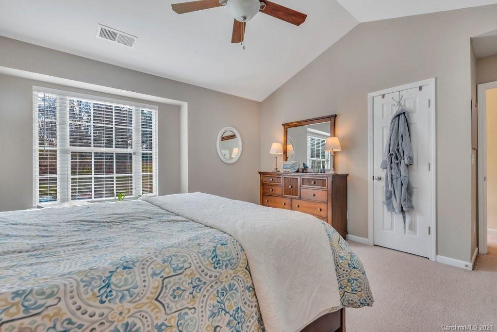 11620 Rabbit Ridge Road Charlotte, NC 28270 - Photo 13 of 24 a bedroom with a large bed and a window