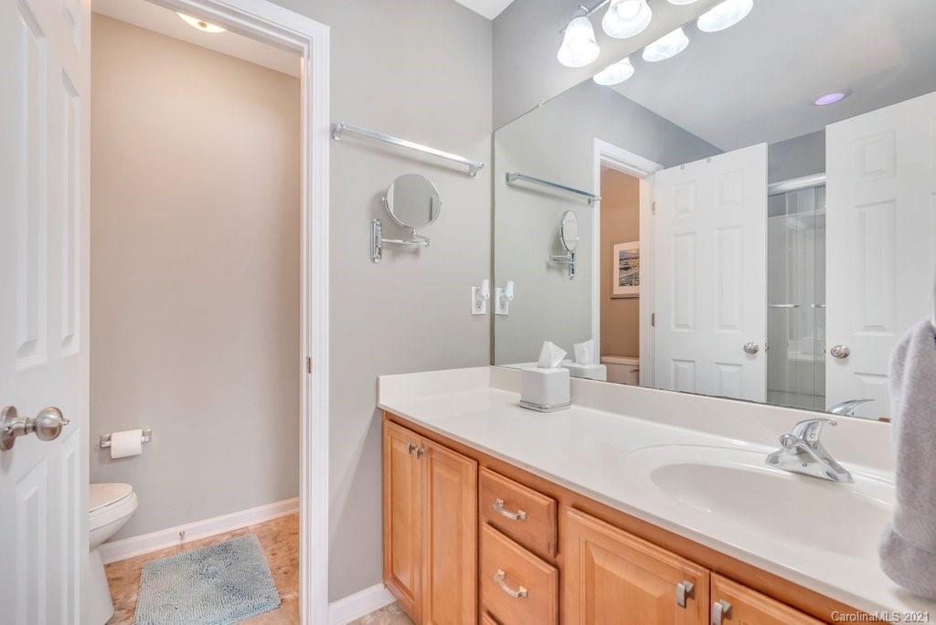 11620 Rabbit Ridge Road Charlotte, NC 28270 - Photo 14 of 24 a bathroom with a sink and a mirror