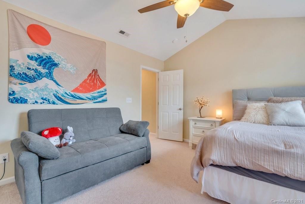 11620 Rabbit Ridge Road Charlotte, NC 28270 - Photo 18 of 24 a bedroom with furniture and a bed