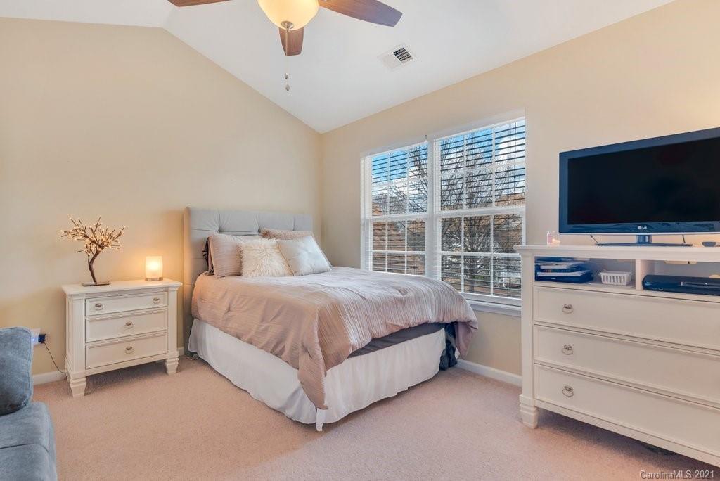 11620 Rabbit Ridge Road Charlotte, NC 28270 - Photo 19 of 24 a spacious bedroom with a bed and dresser