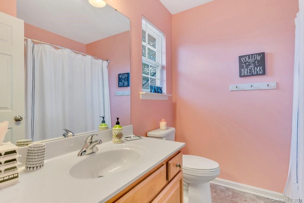 11620 Rabbit Ridge Road Charlotte, NC 28270 - Photo 20 of 24 a bathroom with a sink toilet and vanity