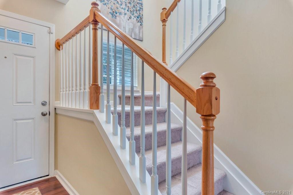 11620 Rabbit Ridge Road Charlotte, NC 28270 - Photo 22 of 24 a view of staircase with railing and white walls