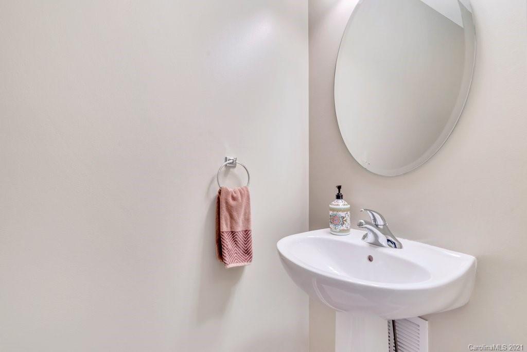 11620 Rabbit Ridge Road Charlotte, NC 28270 - Photo 23 of 24 a bathroom with a sink and a mirror
