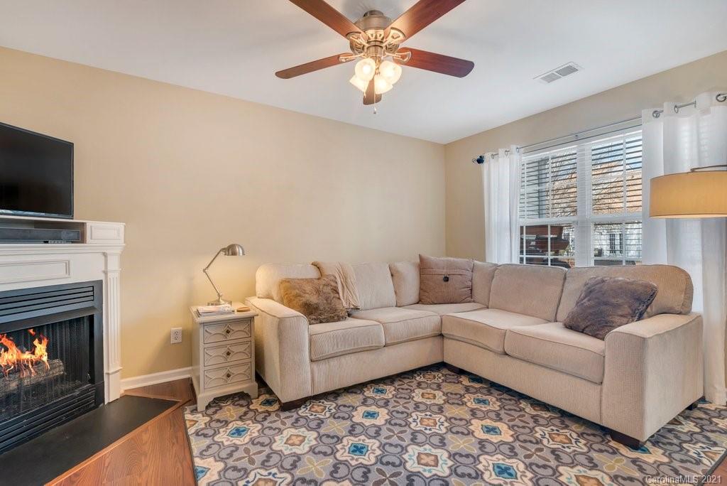 11620 Rabbit Ridge Road Charlotte, NC 28270 - Photo 5 of 24 a living room with furniture and a flat screen tv