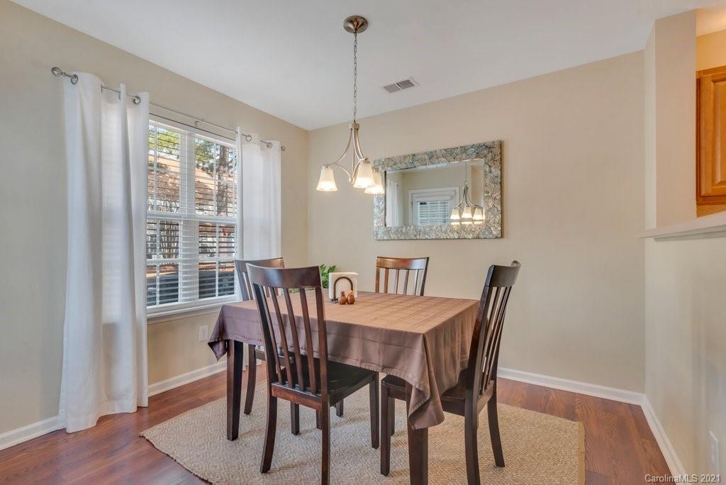 11620 Rabbit Ridge Road Charlotte, NC 28270 - Photo 7 of 24 a view of a dining room with furniture window and wooden floor