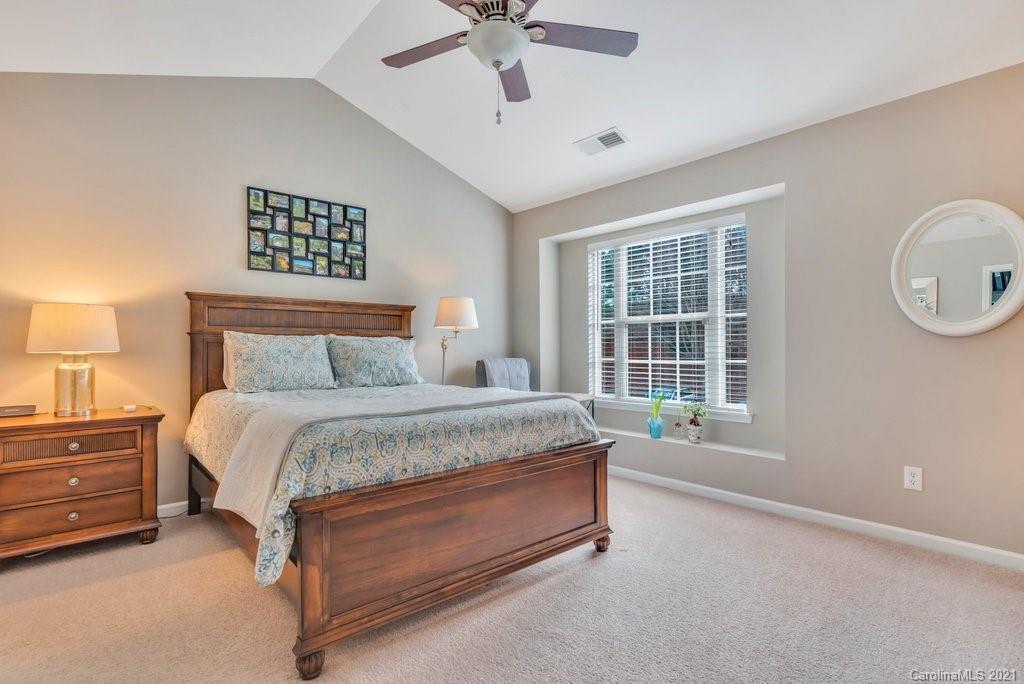 11620 Rabbit Ridge Road Charlotte, NC 28270 - Photo 10 of 24 a spacious bedroom with a bed dresser and a window