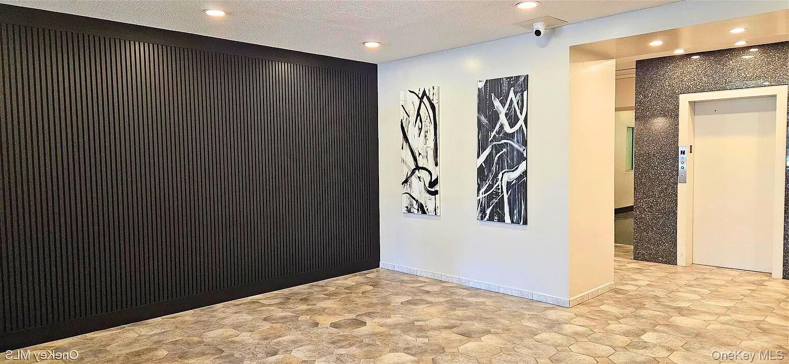 75-24 Bell Boulevard, Unit LD Queens, NY 11364 - Photo 3 of 19 a view of a livingroom with a pathway