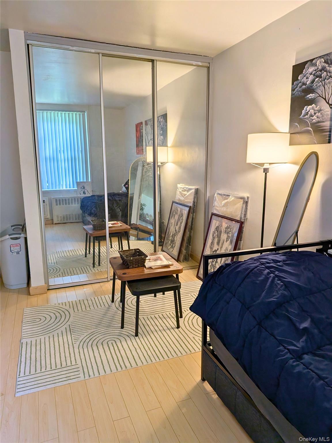 75-24 Bell Boulevard, Unit LD Queens, NY 11364 - Photo 5 of 19 a living room with a couch and a table