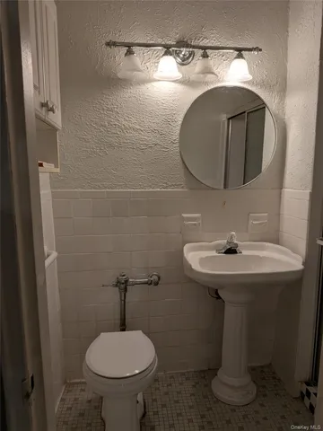 a kitchen with stainless steel appliances granite countertop a refrigerator and a stove