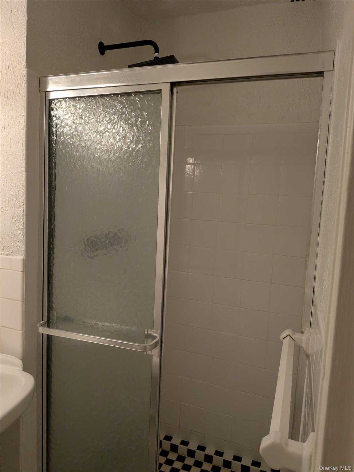 75-24 Bell Boulevard, Unit LD Queens, NY 11364 - Photo 9 of 19 a bathroom with a shower