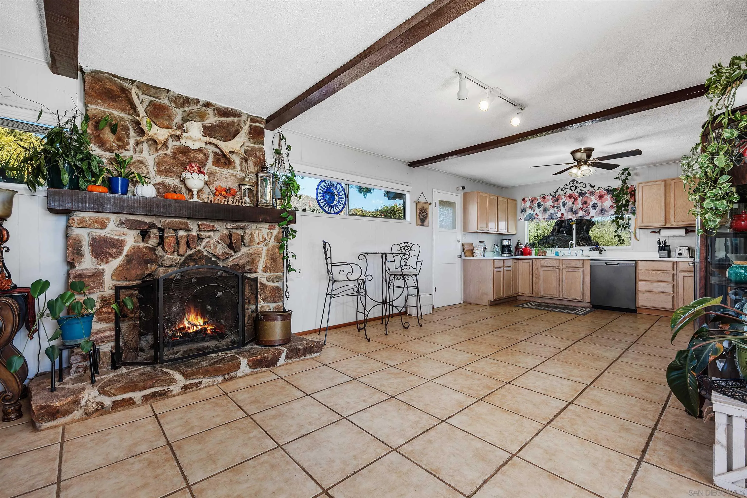 11270 San Luis Rey Drive Valley Center, CA 92082 - Photo 15 of 56 a living room with furniture and a fireplace