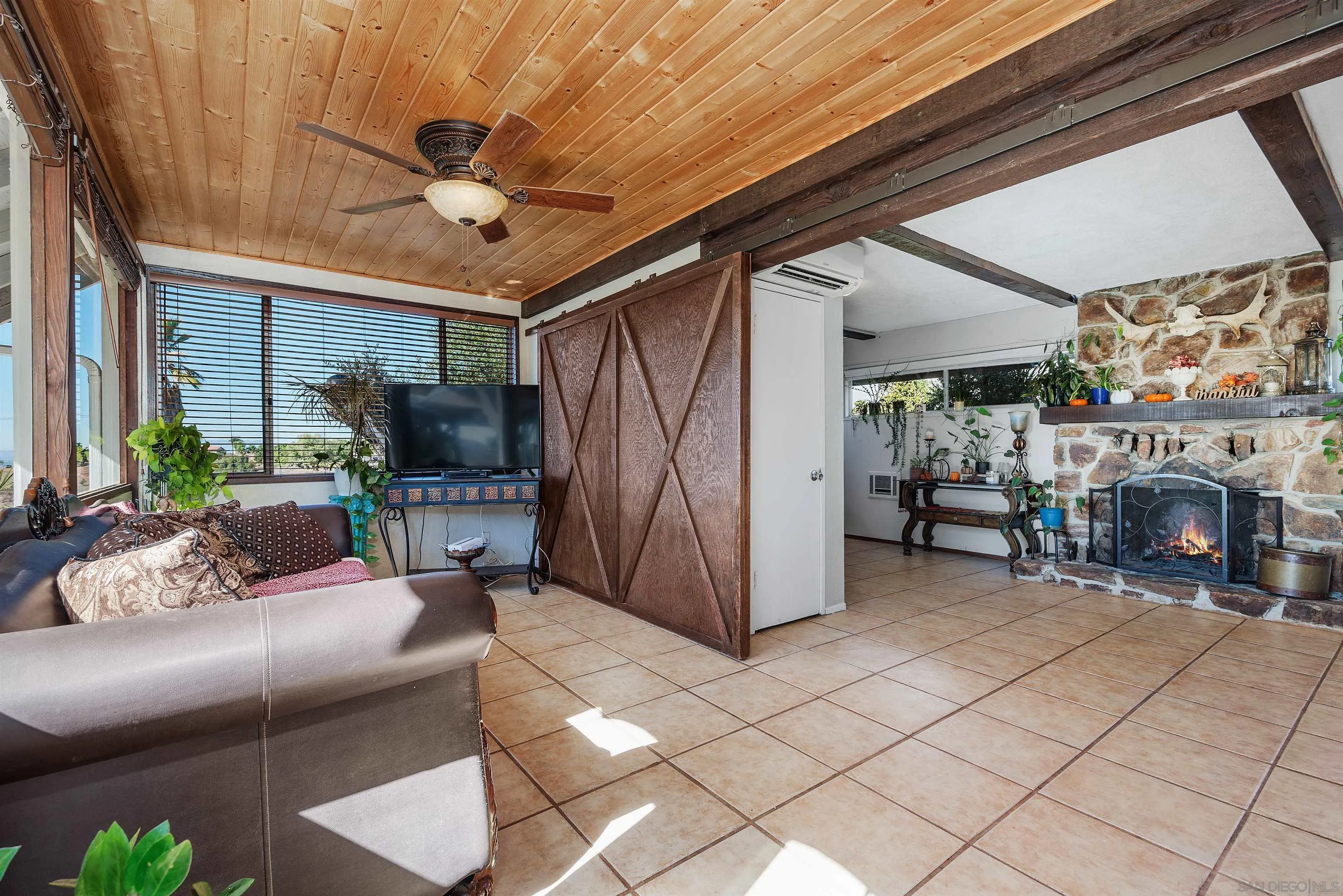 11270 San Luis Rey Drive Valley Center, CA 92082 - Photo 16 of 56 a living room with furniture and a fireplace