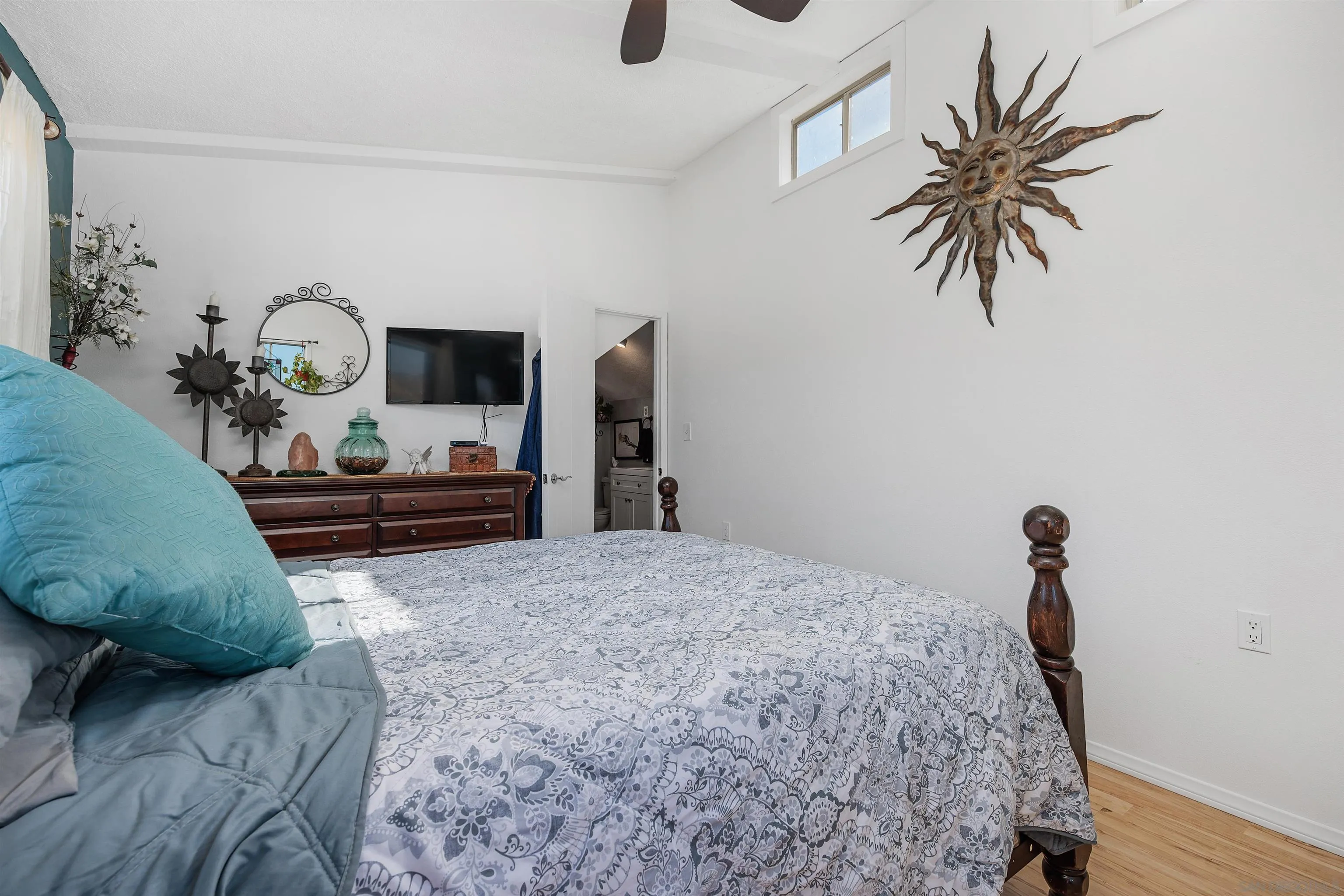 11270 San Luis Rey Drive Valley Center, CA 92082 - Photo 23 of 56 a bedroom with a bed and a chandelier
