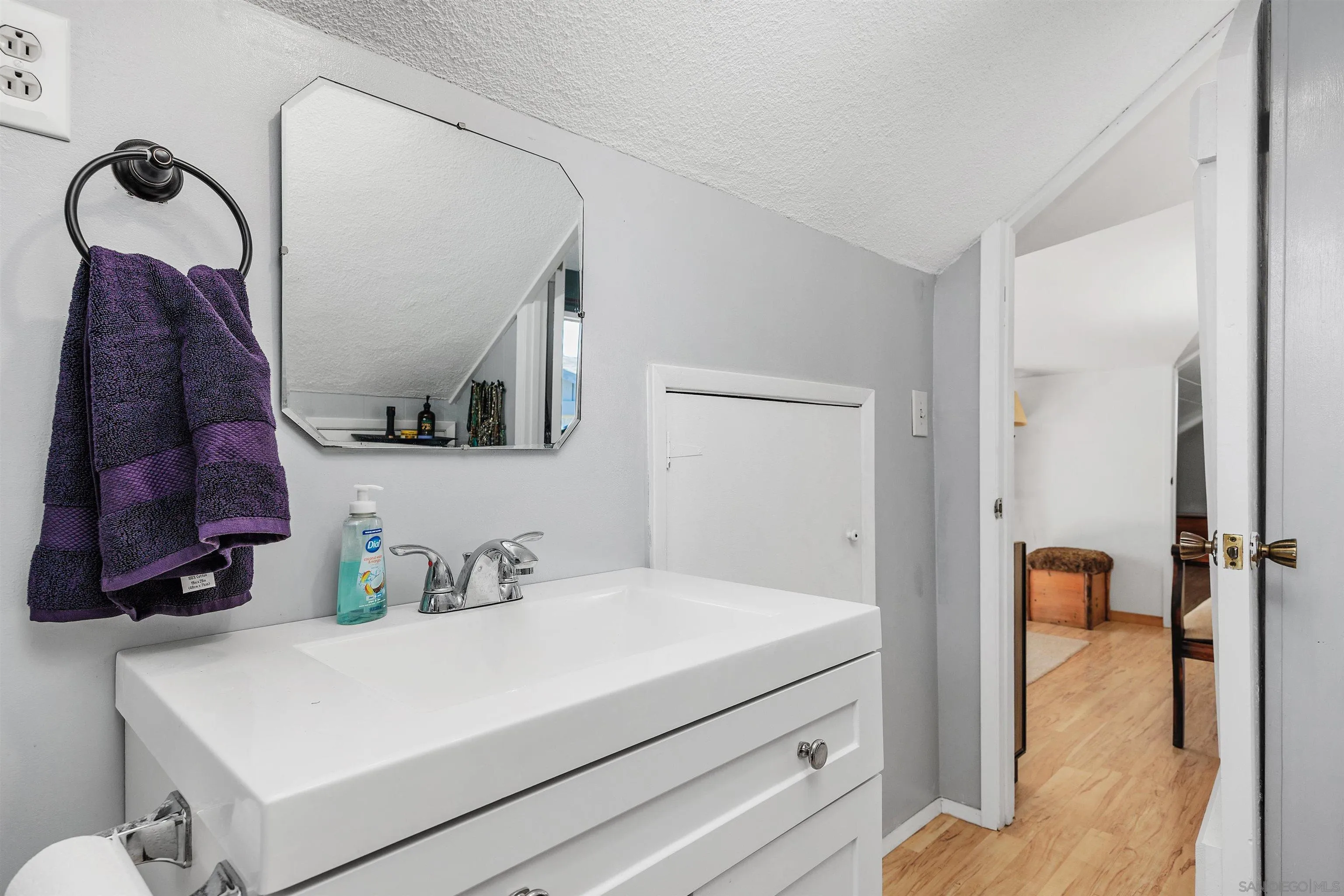 11270 San Luis Rey Drive Valley Center, CA 92082 - Photo 26 of 56 a bathroom with a sink and mirror