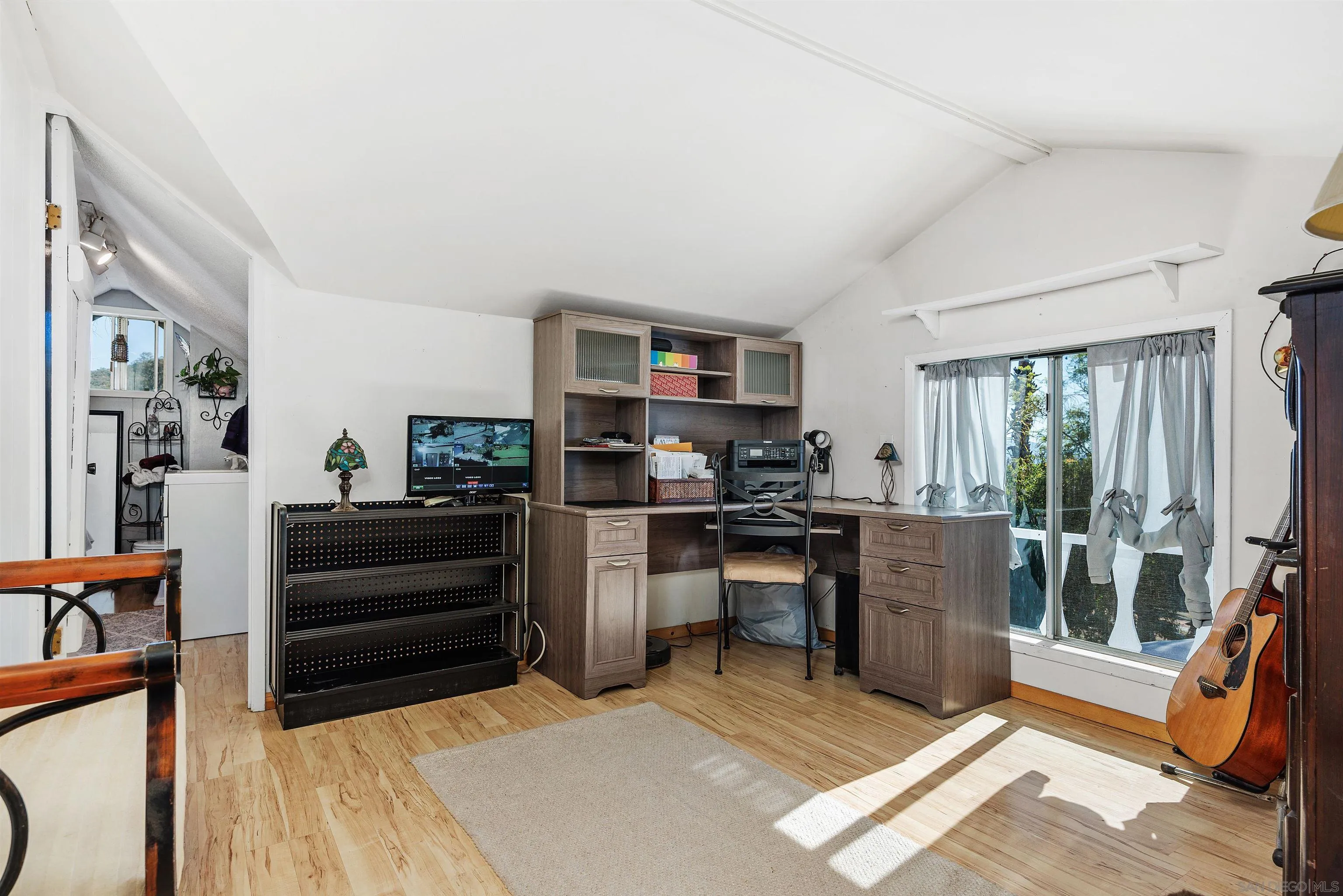 11270 San Luis Rey Drive Valley Center, CA 92082 - Photo 27 of 56 a living room with furniture a rug kitchen view and a large window