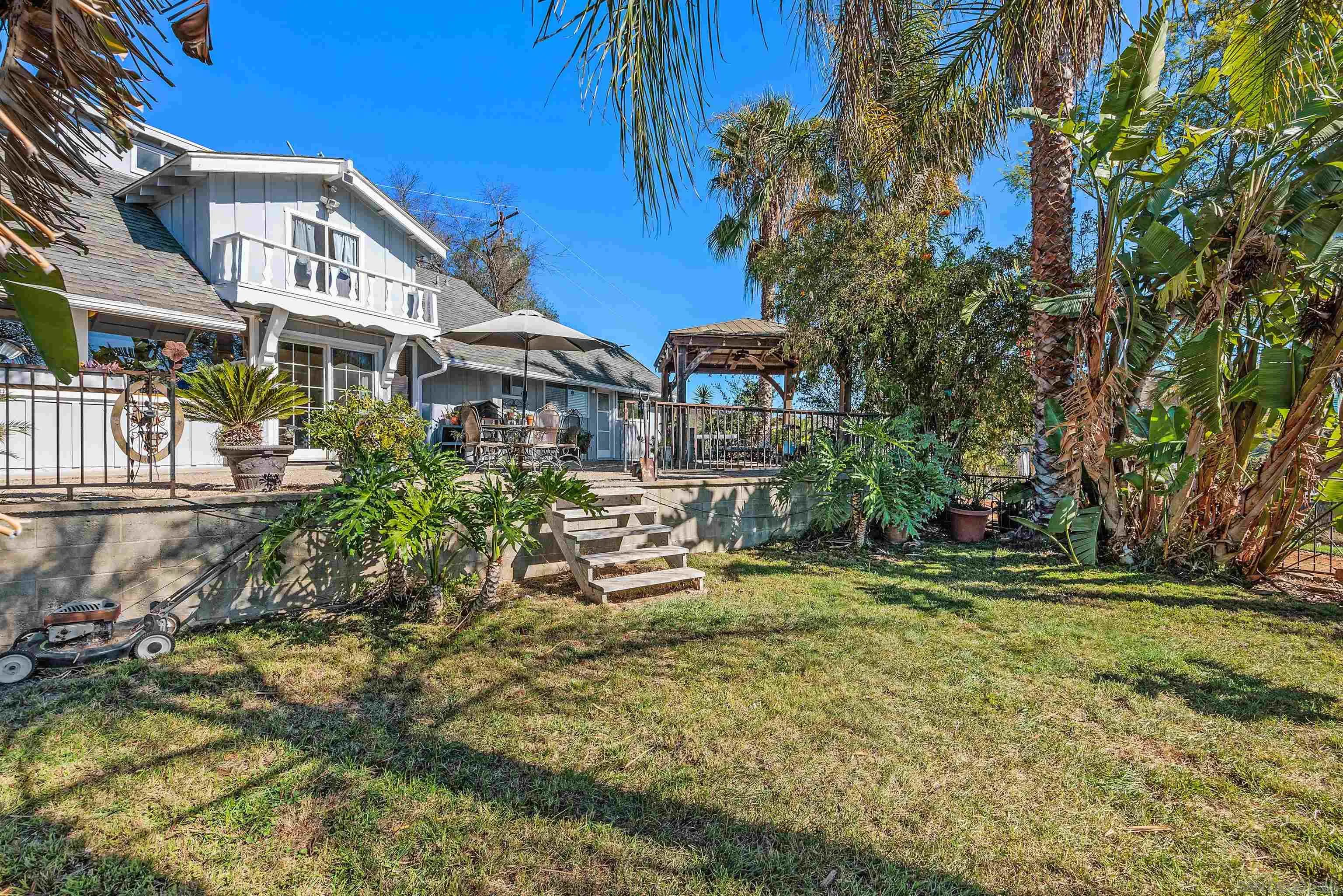 11270 San Luis Rey Drive Valley Center, CA 92082 - Photo 5 of 56 a view of a chairs and table in the patio