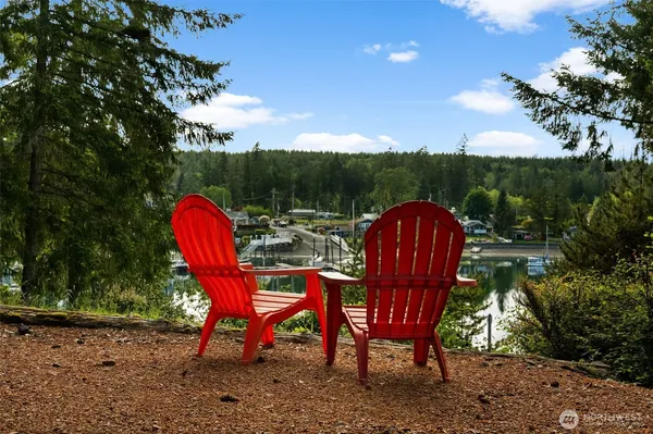 a view of a chairs in backyard of the house
